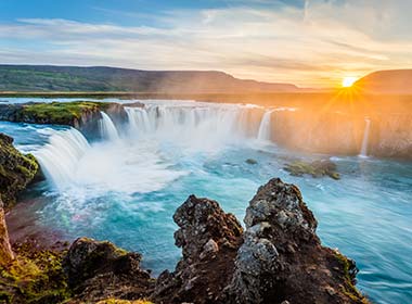 sunset at godafoss waterfall on a tour of iceland