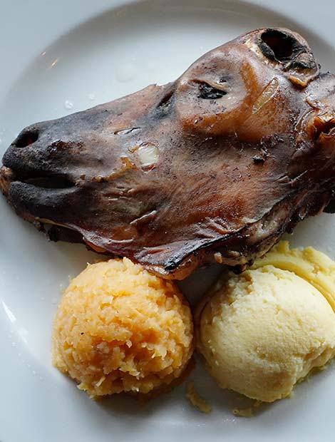 Thorri, Iceland seared sheeps head and potato mash traditional icelandic food at Thorri feast in iceland