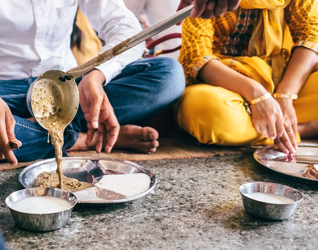 Experience the sensation of making chapatis for the crowds of visitors at the Sikh gurdwara