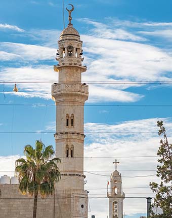 towers of muslim and christian churches in bethlehem israel
