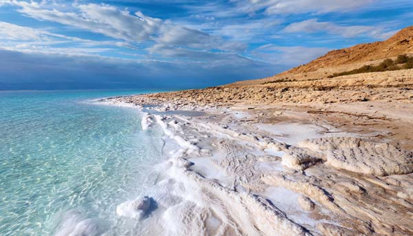 the landscape in israel of the dead sea and rocky coastline clear blue sea