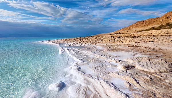 The Dead Sea the landscape in israel of the dead sea and rocky coastline clear blue sea