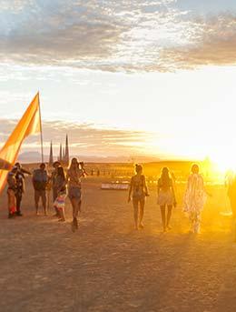 Midburn Festival people walking into the desert for midburn festival negev israel