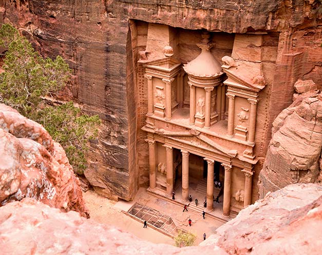 visit petra the ancient rose city in jordan and see the famous treasury carved into red rock