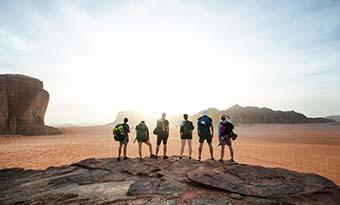 a group tour hiking in the wadi rum desert in jordan