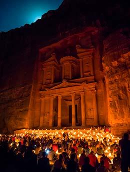 group of people at petra by night event candlelit walk through petra