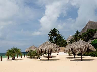 beach with sun loungers in malindi beach kenya