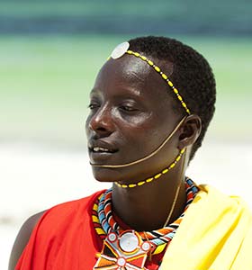Traditional tribal clothing in Kenya Man in Kenya wearing traditional tribal clothing and head gear