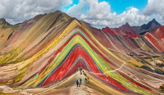 Travel excursions visit rainbow mountain near cusco and wander the amazing landscape in the peru mountain range