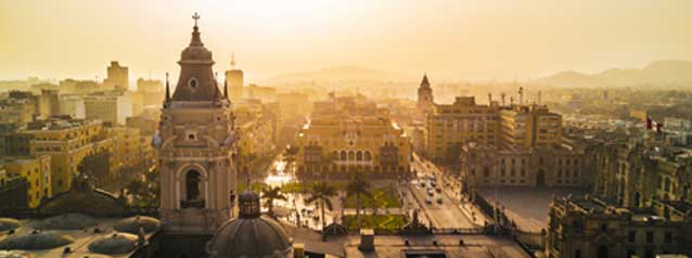 Plaxza de Armas at sunset adventue holiday tour group in lima from an aerial view looking down onto the historic square of plaza de armas at sunset