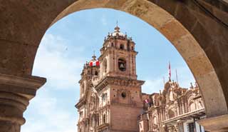 Tourist travel photo of Cusco's cathedral Travel group visit Plaza de Armas is the central square in the old city of Cusco, a city in the Peruvian Andes