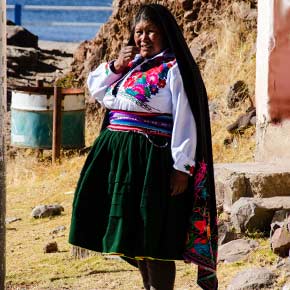 Local native female on the island of Uros, Lake Titicaca peru holidays, discover the amazing lake titicaca when on a vacation trip