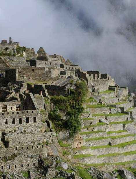 Adventure travel tourist photo of Machu Picchu ruins adventure holiday tours in peru allowing tourists to explroe machu picchu at ease