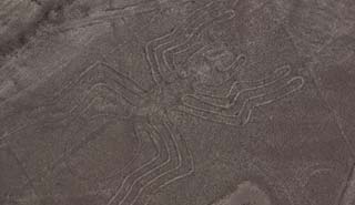 Tourists view pre-Columbian geoglyphs etched into Nazca Desert Travel to see the Nazca Lines, southern Peru are a series of pre-Columbian geoglyphs etched in the Nazca Desert sand