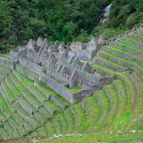 Solo traveler take a photo on Winya Wayna ruins on their way to Machu Picchu