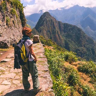 Hiking to Machu Picchu Solo travellers on a group tour at the starting point of the one day hike to Machu Picchu