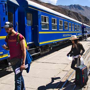 Solo travellers boarding the train in Ollantaytambo on their way to Machu Picchu Solo adventure travelers on a group tour boarding the train in Ollantaytambo near Machu Picchu in Peru