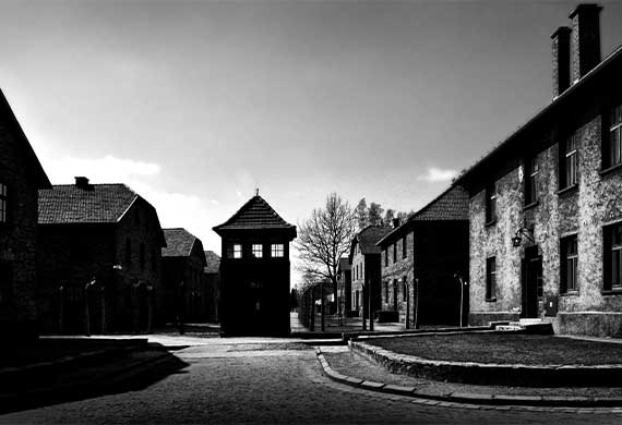 black and white image showing the entrance near Auschwitz Concentration Camp in Krakow