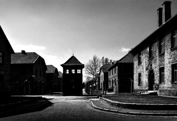 Auschwitz Concentration Camp black and white image showing the entrance near Auschwitz Concentration Camp in Krakow