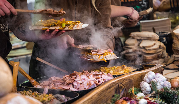 Cost of food and drink in Poland traditional polish street food being served at a market in krakow poland