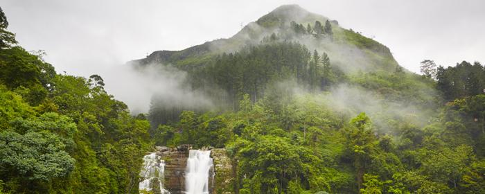 Easter Holiday in Sri Lanka. Tourist photo of Nuwara Eliya waterfall deep in the forest when on tour exploring the country nuawara eliya travel holiday photo through easter bank holiday in sri lanka
