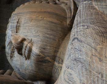 Travel tourist photo of ancient sleeping Buddha statue at Gal Vihara in Polonnaruwa Sri Lankan religious site Gal Vihara of Polonnaruwa is an amazing destination for our Tucan Travel groups to discover