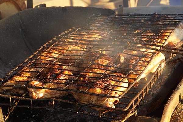 Nyama Choma Festival, Tanzania traditional tanzanian food of meat grilling on a bbq at nyama choma festival
