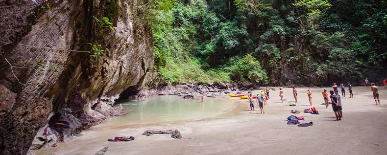 The tiny lagoon of Emerald Beach, Thailand Once you are through the short cave tunnel a small lagoon awaits you on Emerald Beach