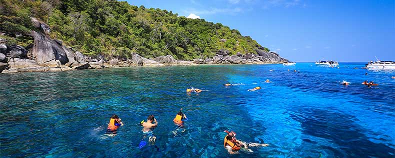 Snorkelling in the Similan Islands people snorkelling off Koh Tachai in the Similan Islands