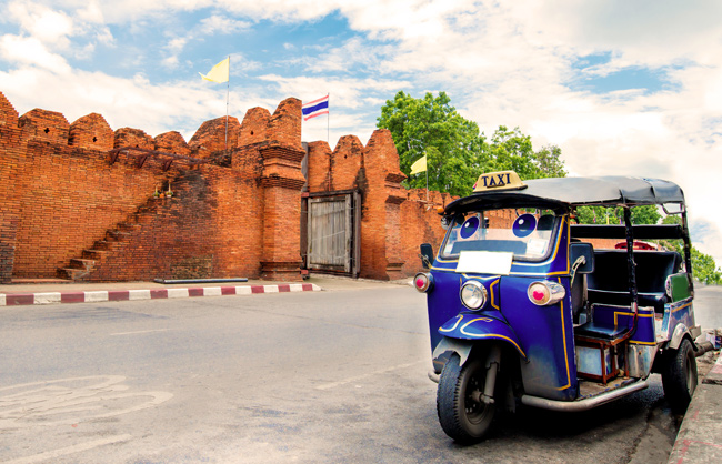 Transport in Chiang Mai A traditional tuk tuk outside the old city walls of Chiang Mai