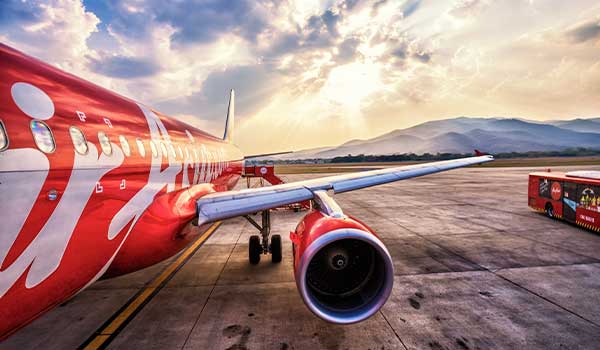 An Air Asia plane in Bangkok airport Air Asia is a popular low cost carrier for flying in Southeast Asia