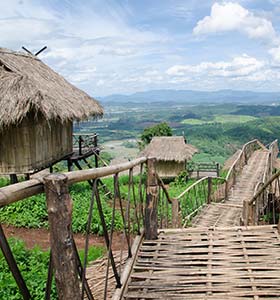 Culture, religion and etiquette in Uganda remote village and huts in uganda overlooking green hills and countryside