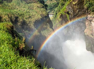 view of waterfall and rainbow over devils cauldron at murchison falls national park in uganda