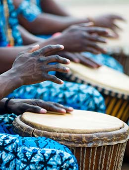 This is Uganda, Uganda group of people playing traditional african drums at this is uganda festival in uganda