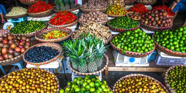 Fruit and veg stall in Hanoi Holiday tours visit many markets and stall for tourist to experieicne the food and culture in Vietnam