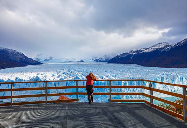 solo female visiting los glaciares national park looking at the Perito Moreno Glacier