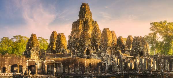 Bayon is known for its massive ancient stone faces in Angkor Wat