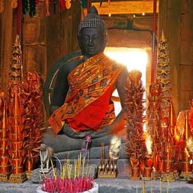 Buddhist statue at a temple is decorated Pchum Ben is a cultural celelbration of Buddhism