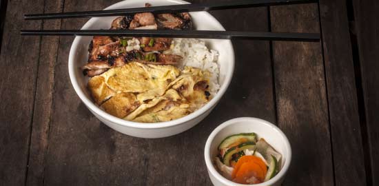 Cambodian breakfast - rice & omelette Delicious south-east asian cuisine is often eaten with copsticks in cambodia