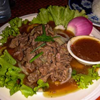 Lap khmer is a beef based cuisine that consists of slices of beef marinated in spices and served with veg