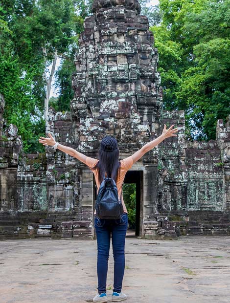 Female solo tourist discovers Angkor Thom Female solo holiday maker explores Angkor Thom