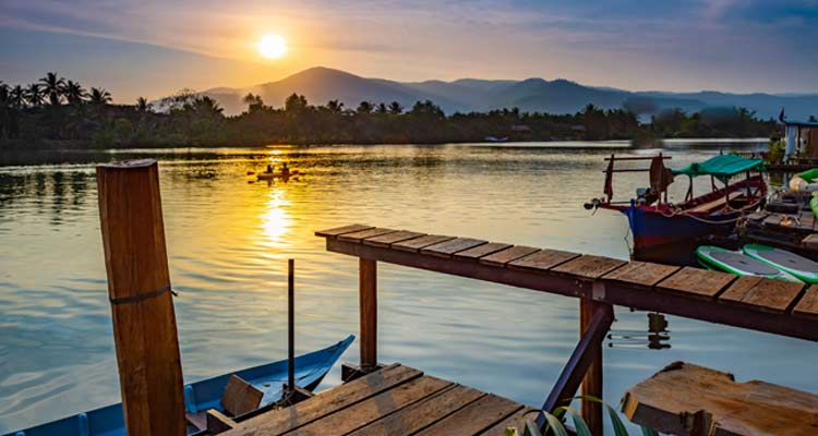 tourist photo beautiful sunset over Kampot lake, Vietnam