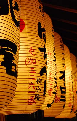 Nagasaki Lantern Festival, Japan row of gold yellow paper lanterns on streets of nagasaki japan for nagasaki lantern festival