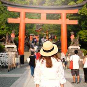 Solo tourist on holiday visits Fujimi Inari lady travelling in japan visits fujimi inari in kyoto whilst on her holiday tour