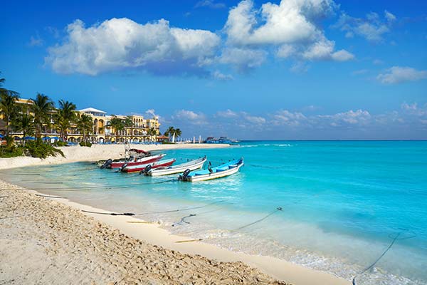 Playa del Carmen boats lined up in the shore of playa del carmen