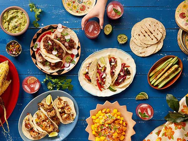 Traditional food spread in Mexico table spread of traditional mexican food on a blue wooden table
