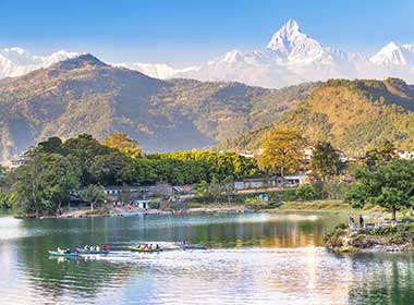 travelers in nepal visit pokhara lake and the annapurna foothills