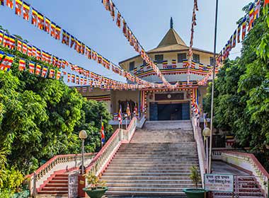 Lumbinni temple decorated in colourful flags in Nepal