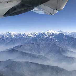 View over the himalayan mountain range from above whilst flying via airplane
