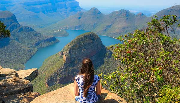 Blyde River Canyon, South Africa A solo traveller looks out over the cliffs of Blyde River Canyon in South Africa